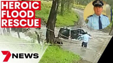 Cop saves three people from submerged vehicle  | 7NEWS